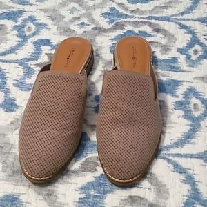 indigord mules. Brown suade with perforated texture.